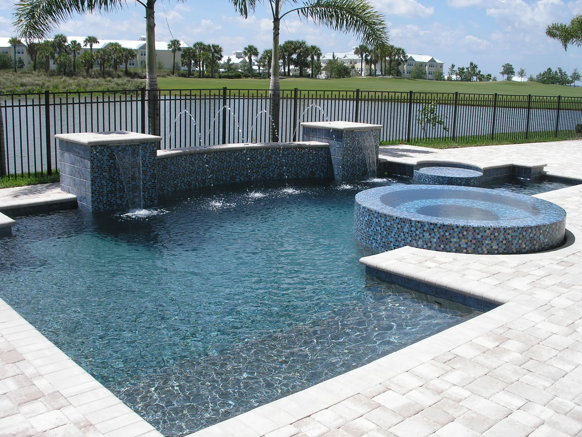Raised round spa with spillover