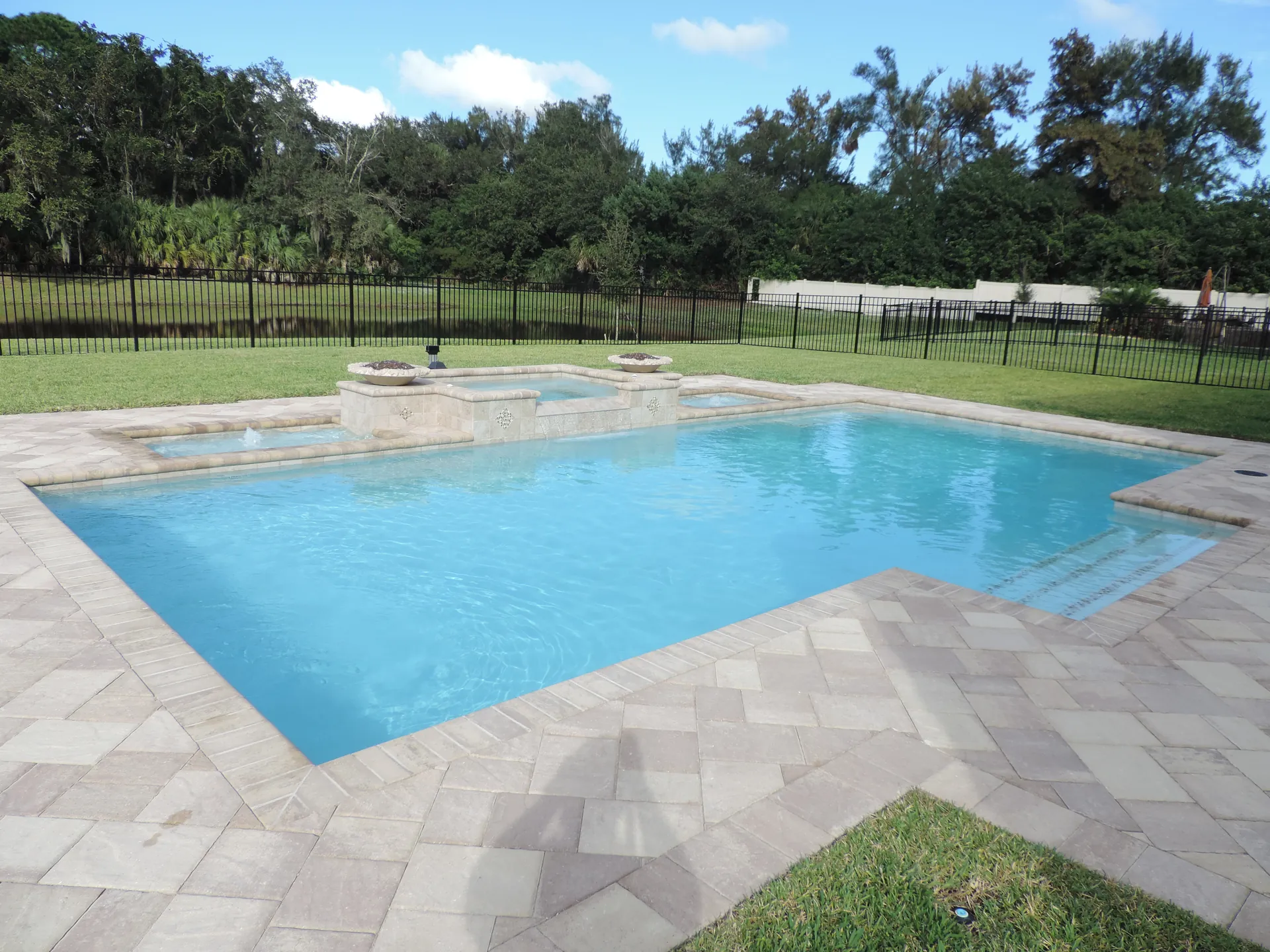 Raised spa with spillway