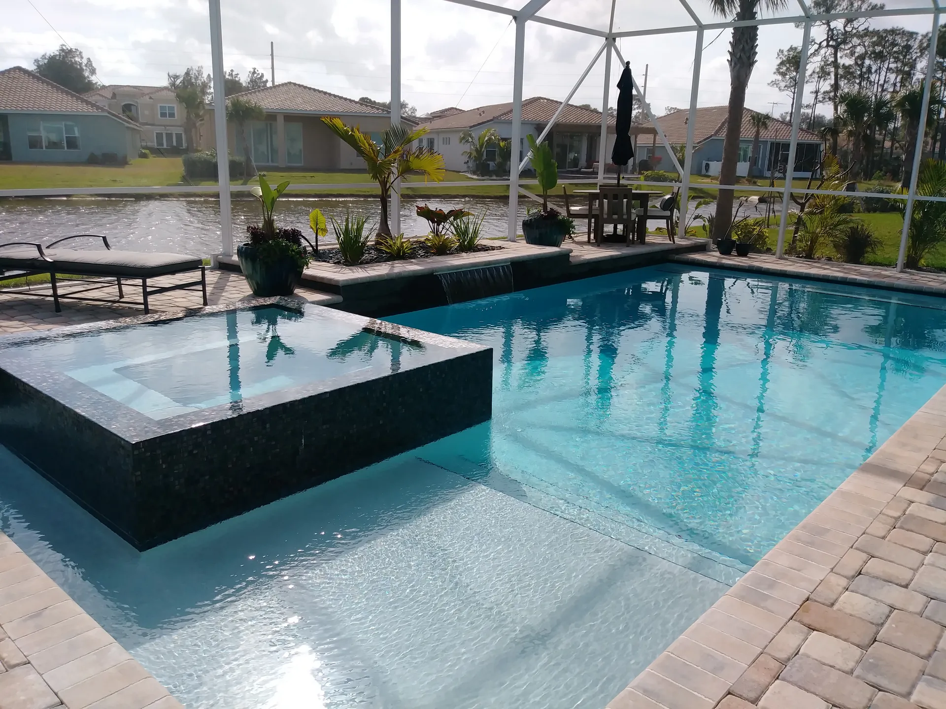 Dark glass-tile overflow spa