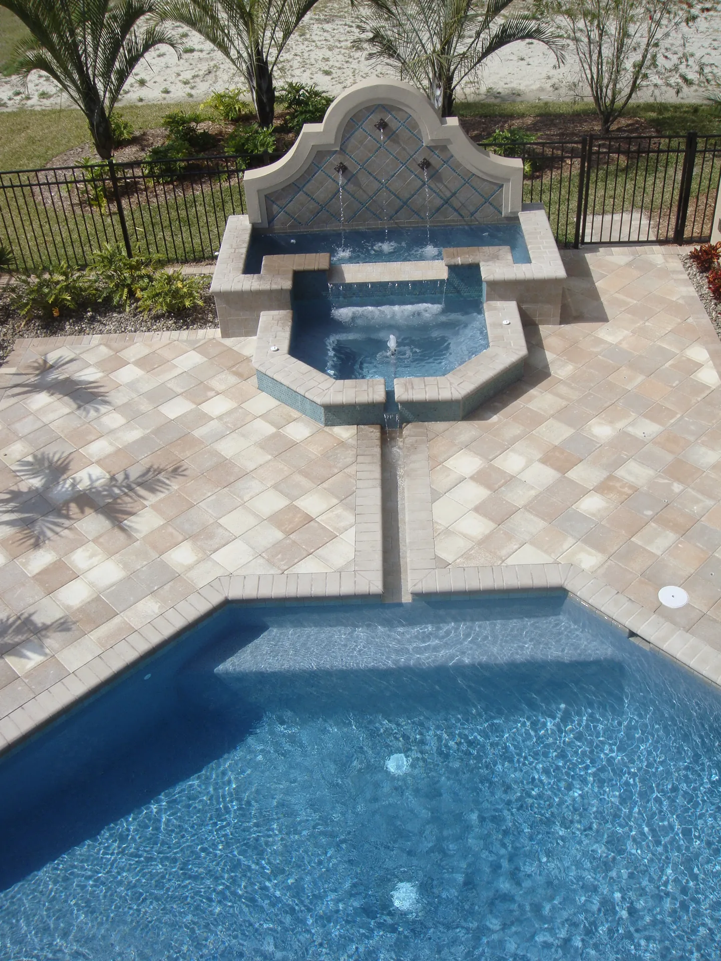 Arched fountain wall with scuppers